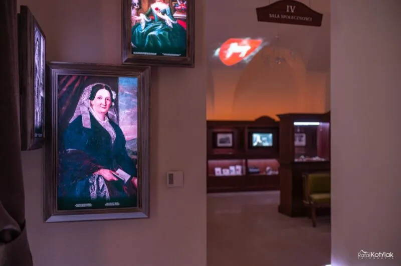 The dark halls of the Nature and Education Center in Sobieszów are filled with illuminated digital portraits, screens, and interactive stations dedicated to the history of the region.